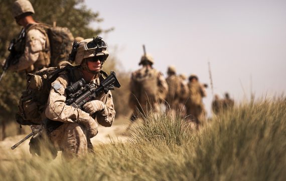 GOWRAGI, Helmand province, Islamic Republic of Afghanistan Ñ Lance Cpl. Kyle R. Lamoreaux, a squad automatic weapon gunner with the Combined Action Company, 3rd Battalion, 3rd Marine Regiment, holds security while on patrol in Gowragi, Afghanistan, during a clearing operation, Sept. 29, 2010. The clearing operation was followed by a sustained presence in the area. (Official Marine Corps photo by Sgt. Mark Fayloga)